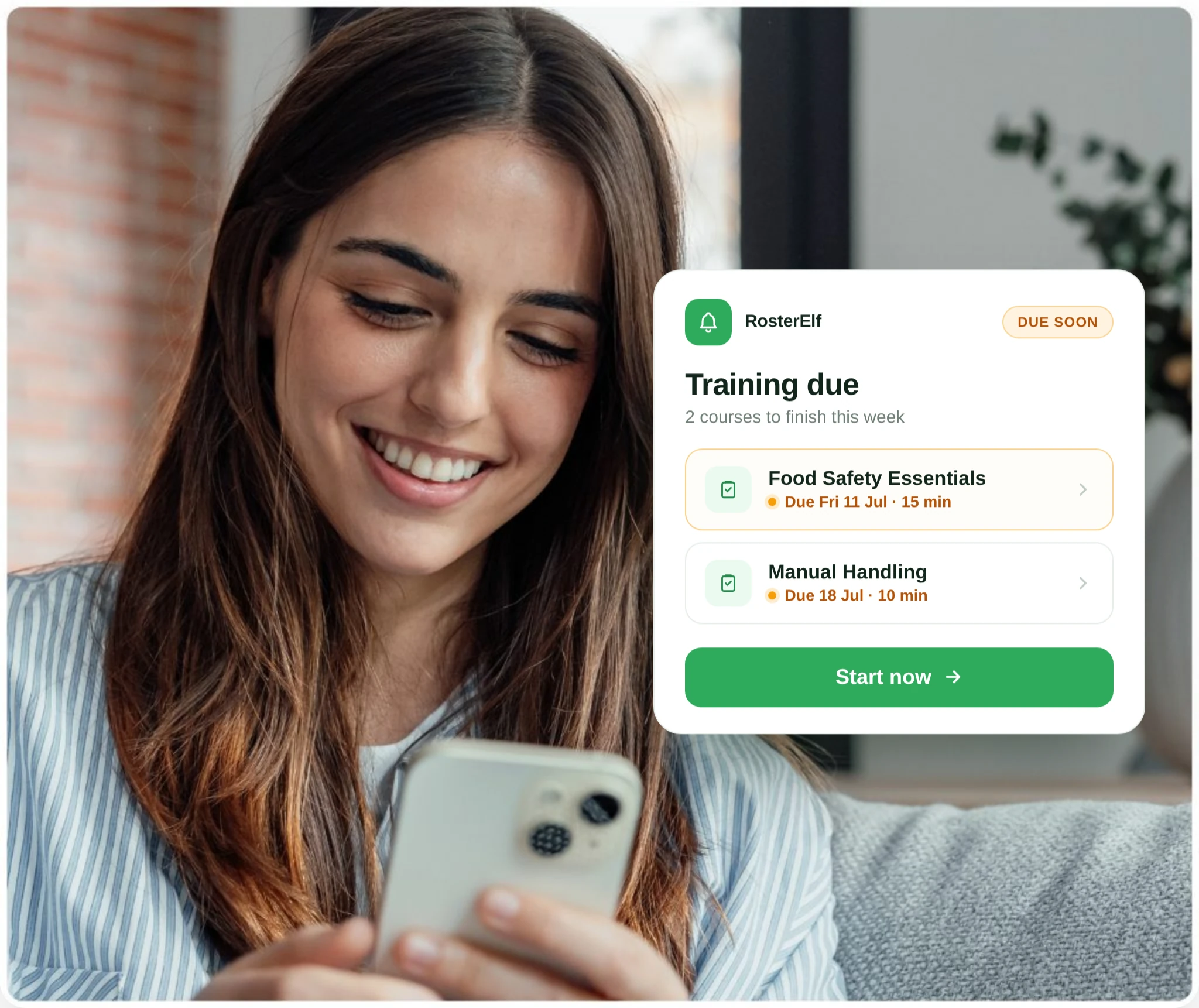 Employee viewing a training-due notification with courses to finish on her phone