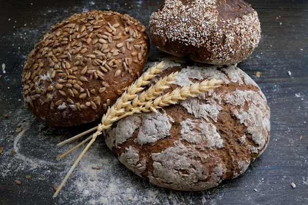 Bakery staff preparing fresh pastries and bread