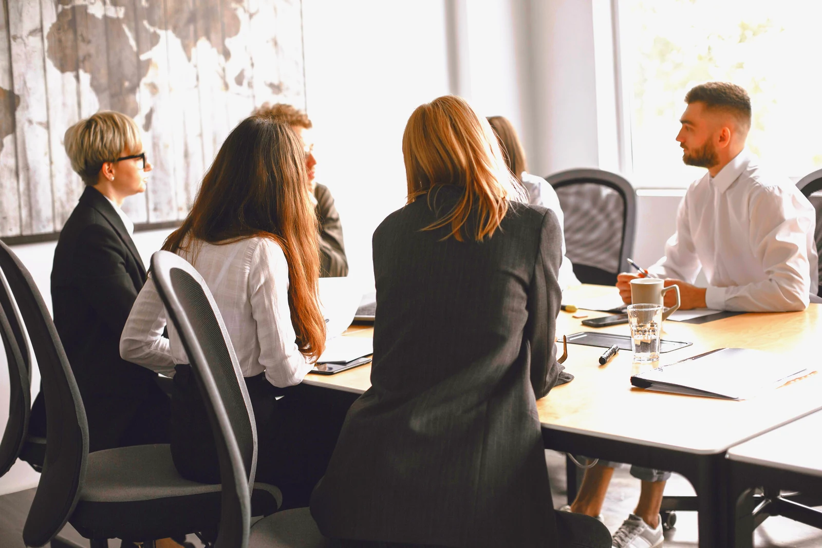 Council staff in a meeting around a boardroom table