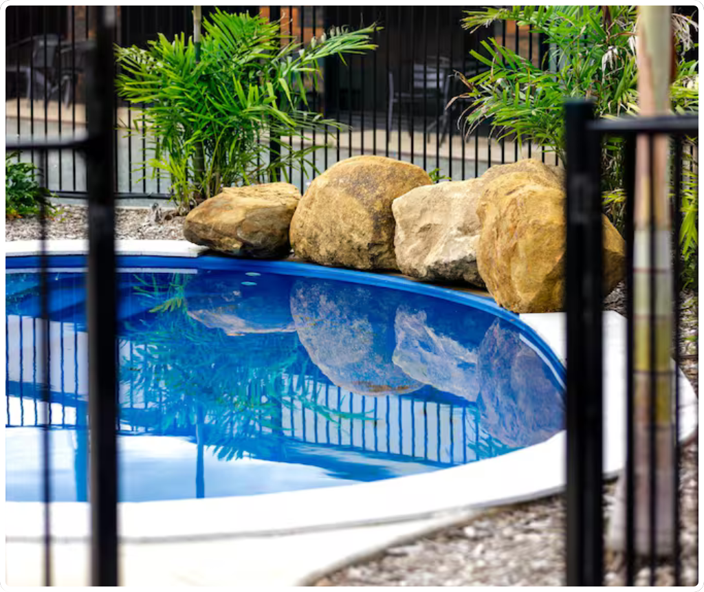 Opal Ridge Motel pool area with tropical landscaping in Collinsville Queensland