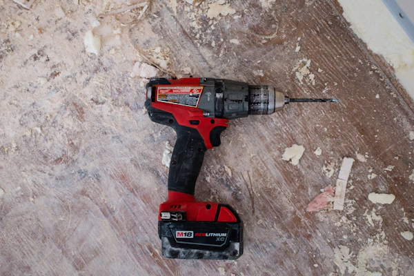 Hardware store staff assisting tradesperson with supplies