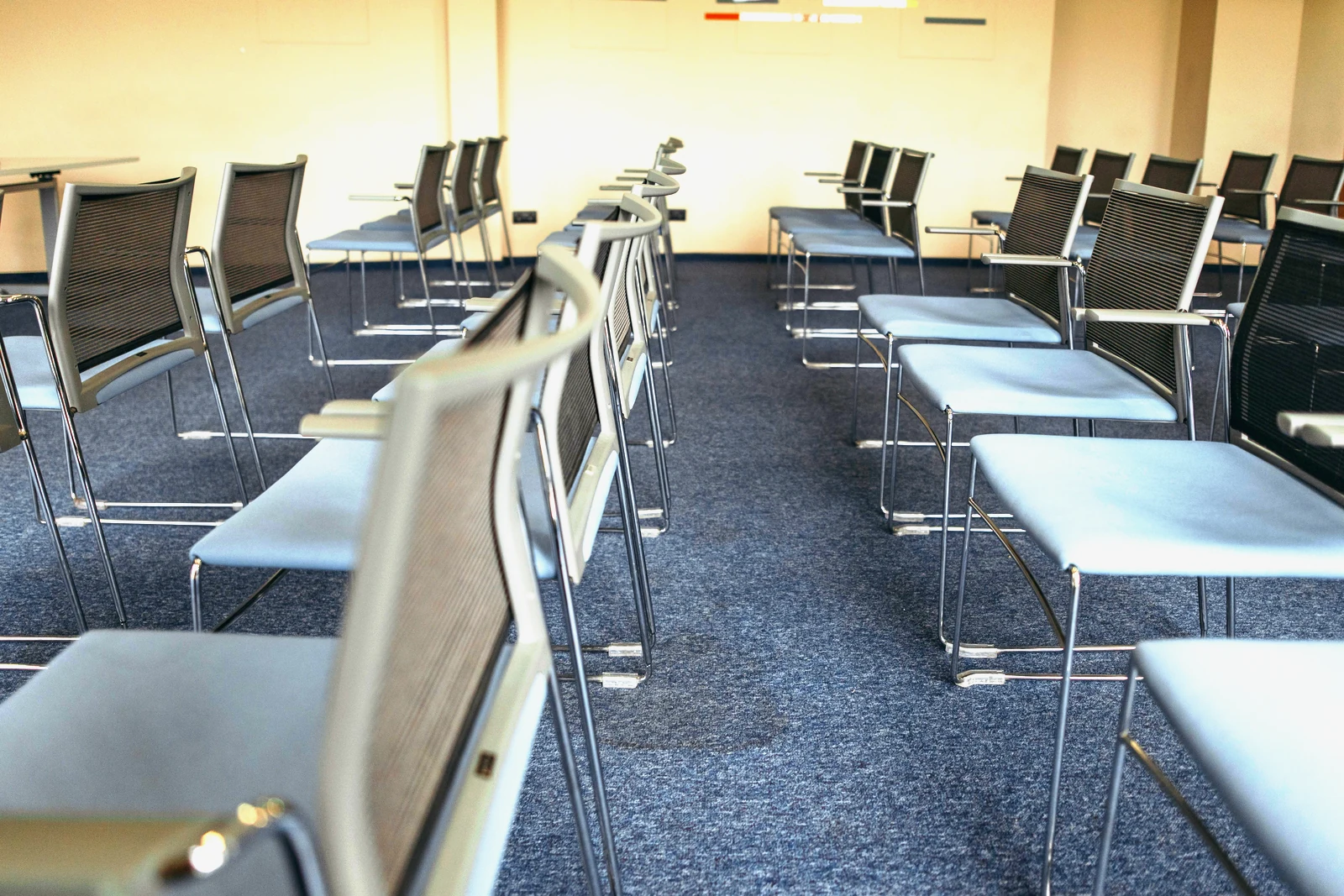 Conference room setup with AV equipment and presentation screen