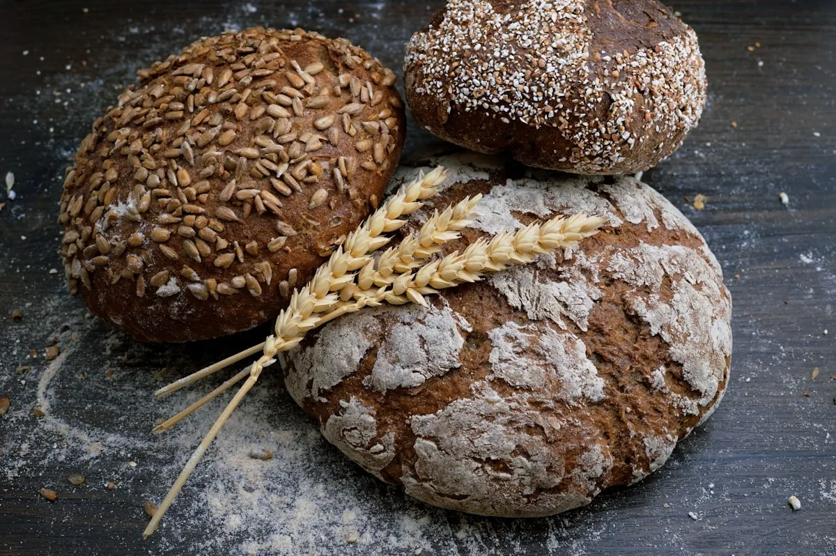 Bakery assistant preparing fresh bread