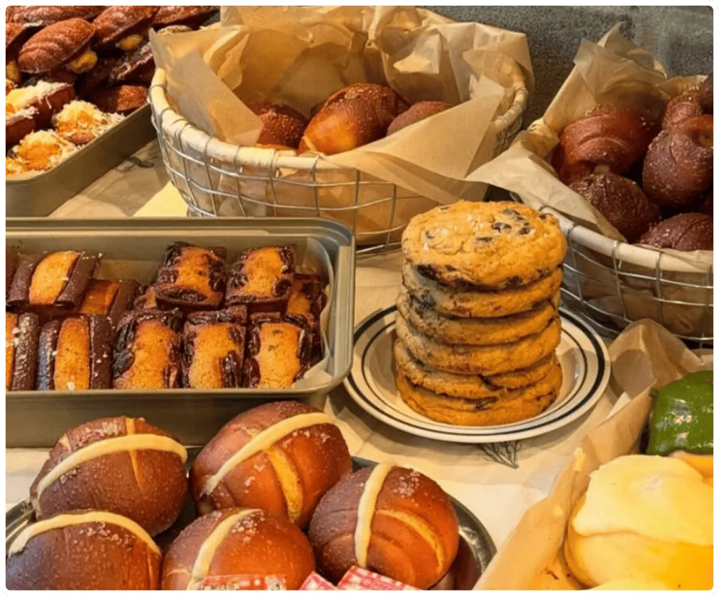 Stone Valley Bakehouse baked goods display with pretzel buns, cookies, and pastries